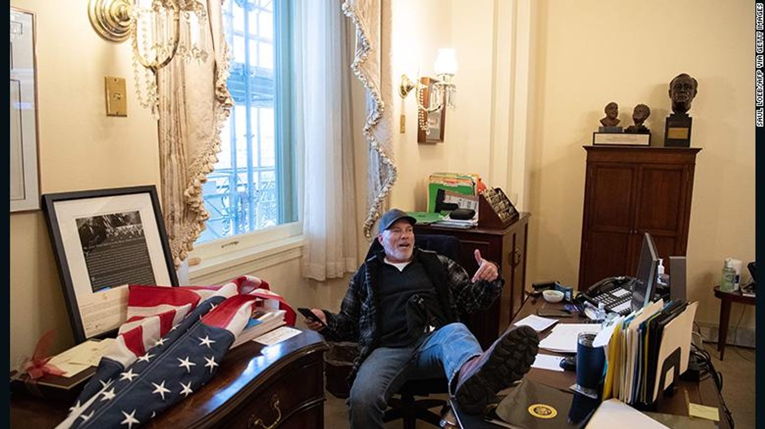 Richard Barnett sat inside the office of House Speaker Nancy Pelosi during the January 6 riot