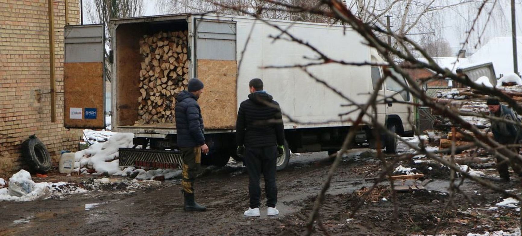 Distribution of firewood to people living without heating and electricity in Borodianka, Ukraine, December 2022